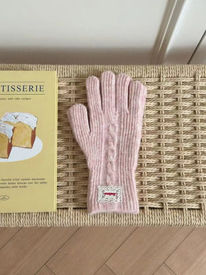 Pink cable knit acrylic gloves with embroidered patch detail