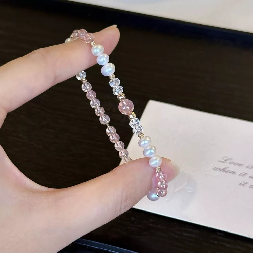 Delicate pearl and crystal bracelet with pink accents and gold beads
