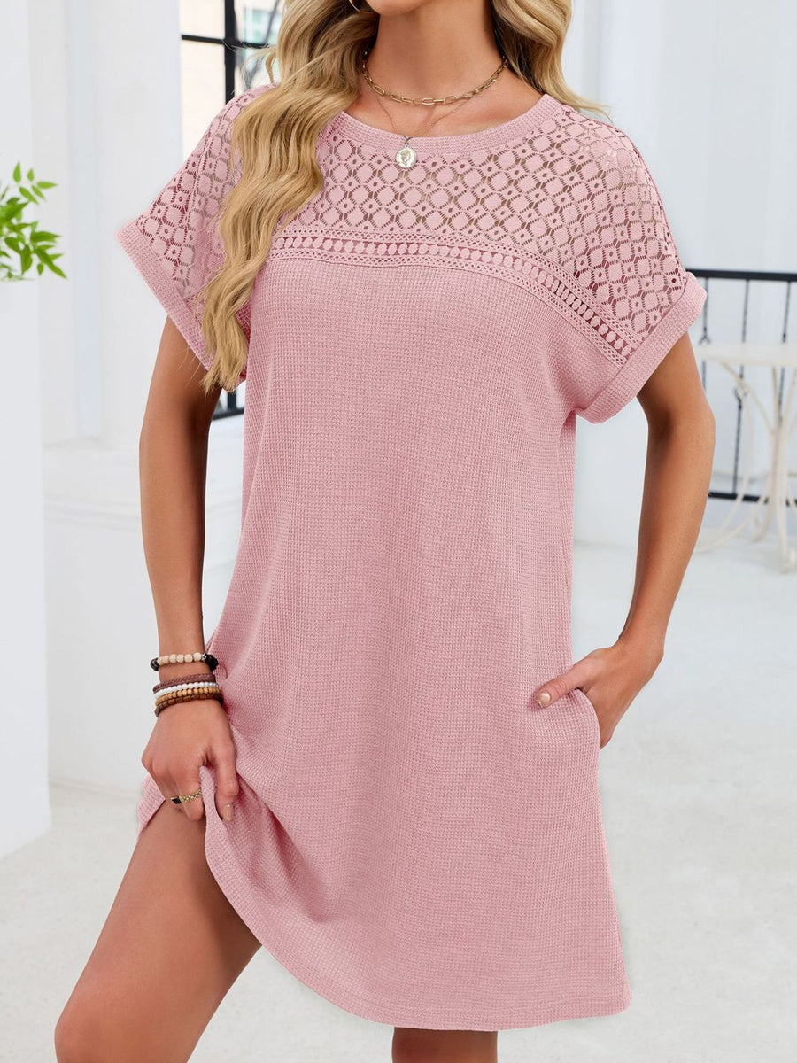 Blush pink t-shirt dress with sheer lace yoke and short sleeves.