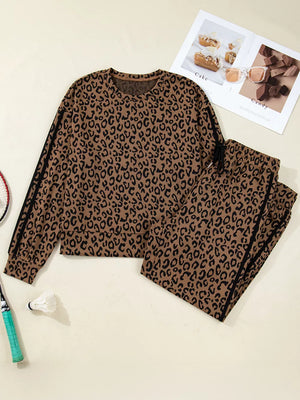 Leopard print loungewear set with drawstring joggers and long sleeve top with side stripes.