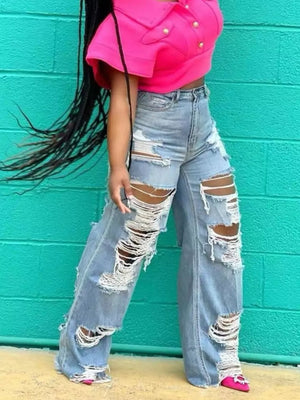 Distressed light wash denim wide-leg maternity jeans with drawstring waist and extreme rips.