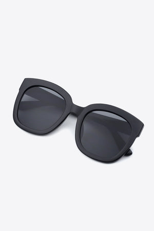 Black square sunglasses with thick frames and dark lenses.