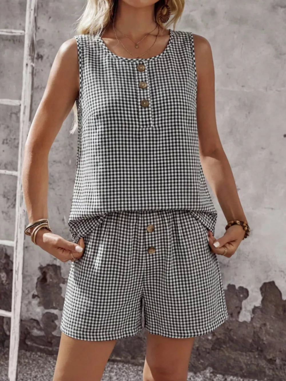 Black gingham two-piece set with button-down sleeveless top and shorts.