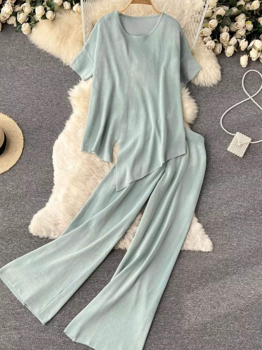 Light green tied waist two-piece set with wide leg pants and short sleeve top.
