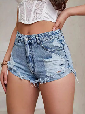 High-waisted distressed denim shorts in Vintage Washed Blue with frayed hem and rips.