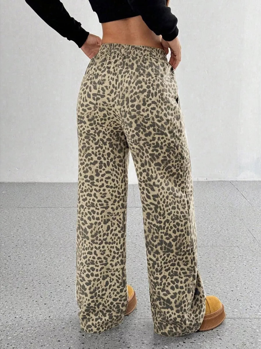 wide-leg pants in black with drawstring waist and full-length