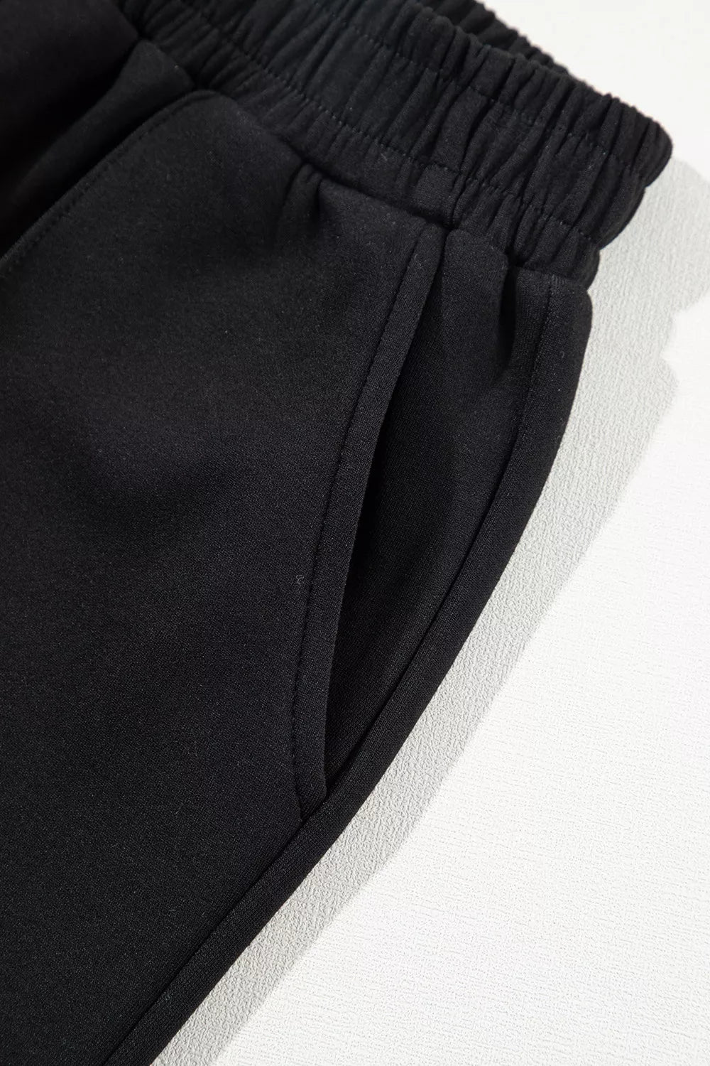 50% polyester, 45% viscose, 5% elastane Care instructions: Machine wash cold sweatshirt and sweatpants set in black with