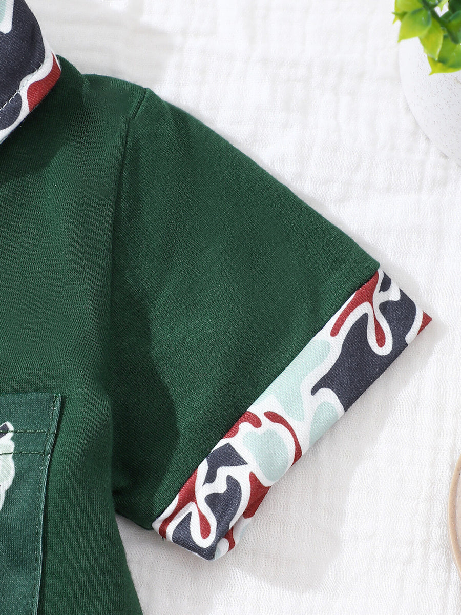 Dark green baby polo shirt with camouflage trim on collar and sleeves