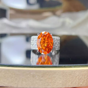 ring in orange featuring 8 carat moissanite and band with center stone fit