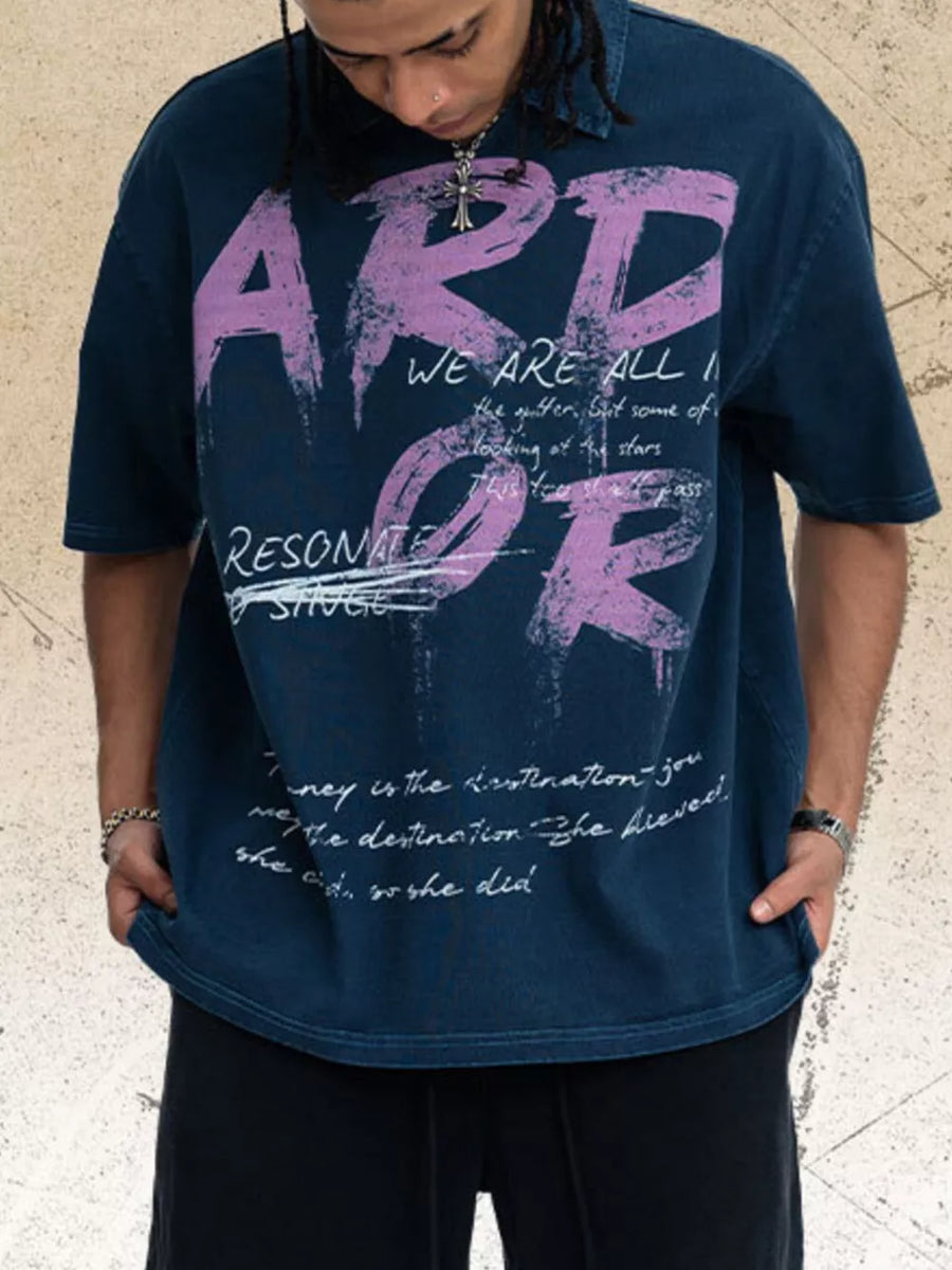 Distressed graphic tee in blue with relaxed fit and artistic brushstroke print.