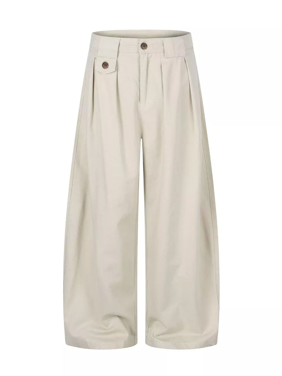 wide-leg pants in beige featuring pleated front and wide-leg fit