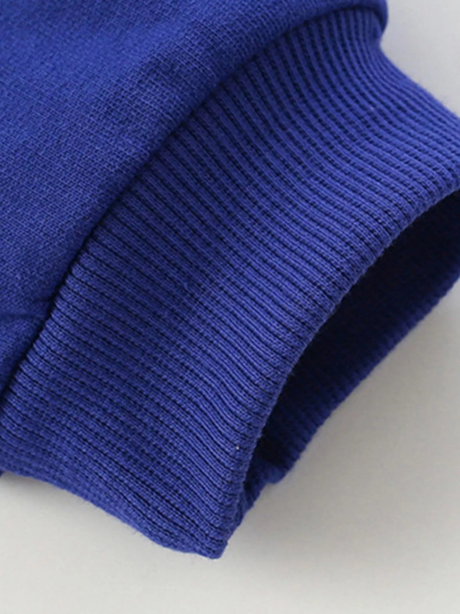 Navy blue kids' sweatshirt cuff detail with ribbed texture.