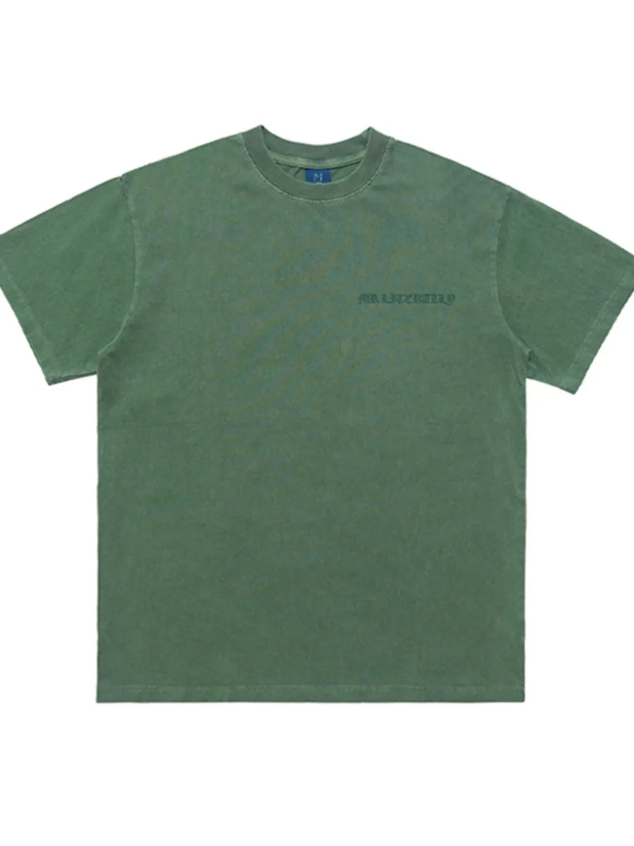 Green oversized graphic tee with a small chest graphic and crew neck.
