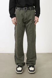 Army green wide-leg jeans with utility pockets and contrast stitching.