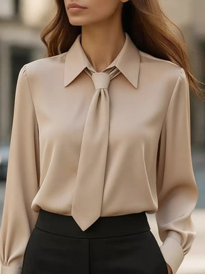 blouse in light beige featuring tied neck and regular fit