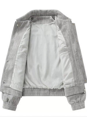 Grey corduroy trucker jacket with white lining and elastic cuffs and hem.