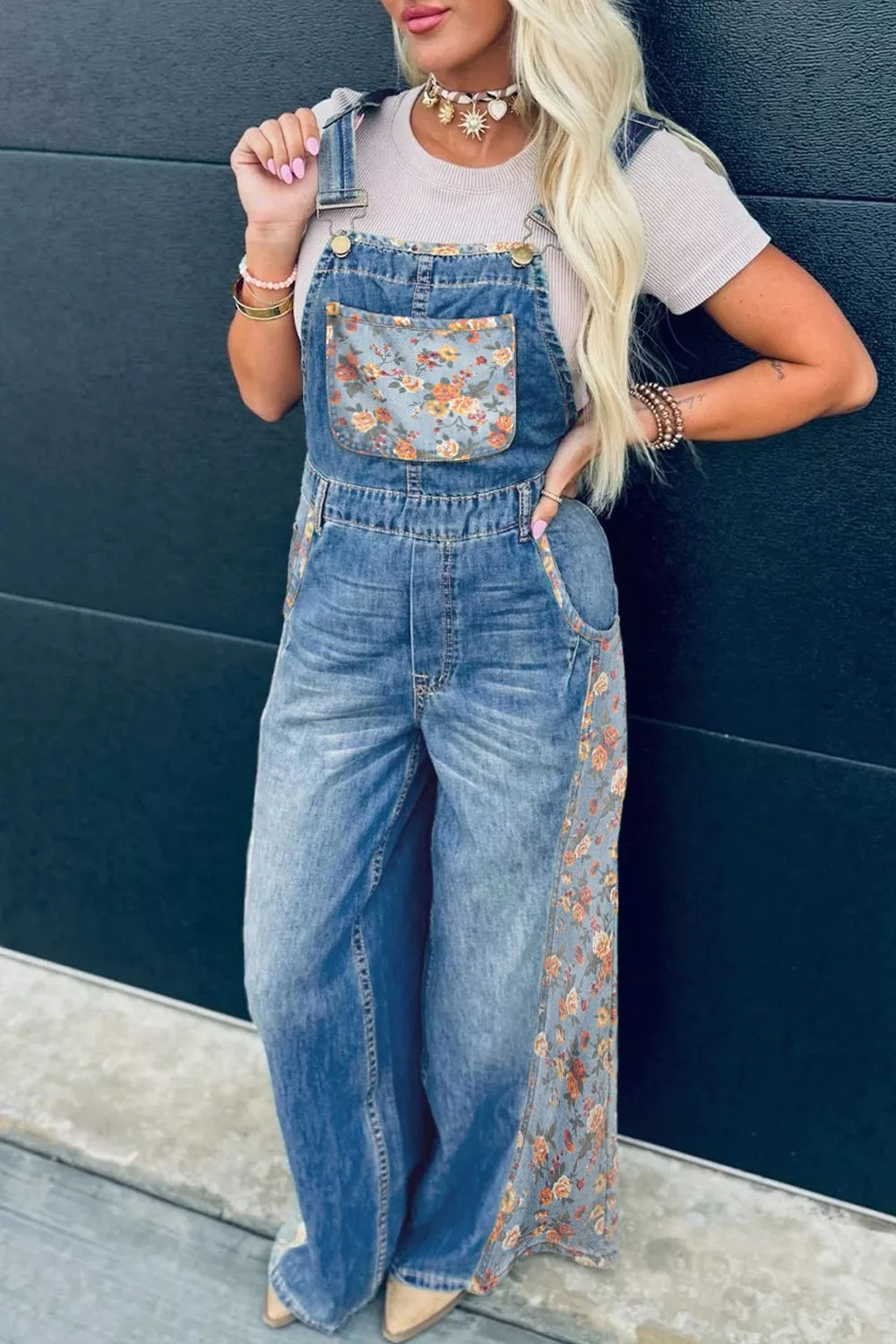 Denim overalls with vintage floral print on pocket and side seams.