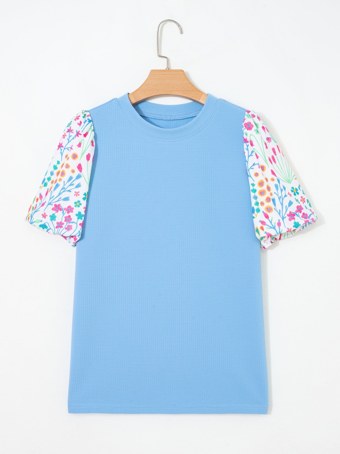 Textured blue blouse with abstract floral bubble sleeves