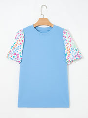 Textured blue blouse with abstract floral bubble sleeves