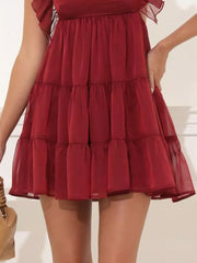 Brick red ruffled mini dress with tiered skirt and square neckline.