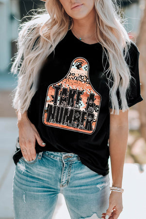 Black graphic t-shirt with "Take A Number" text on a tag design with leopard and camouflage print.