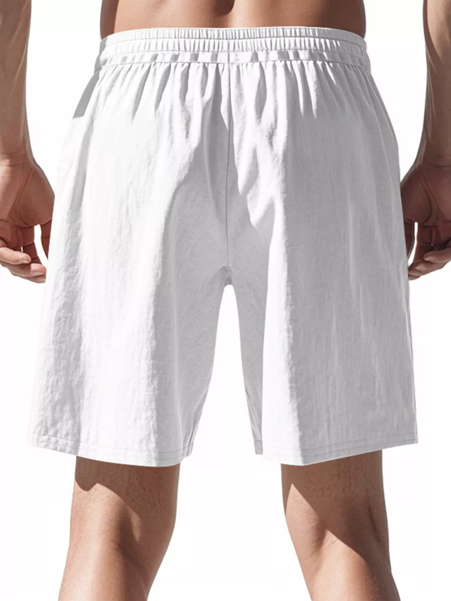 White chino shorts with elastic drawstring waist and relaxed fit for men.