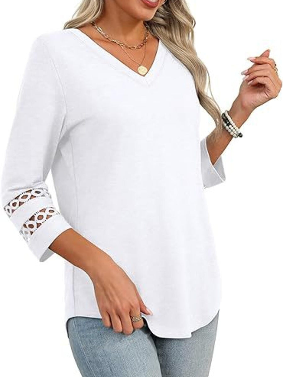 White 3/4 sleeve t-shirt with V-neck and cutout detail on sleeves.