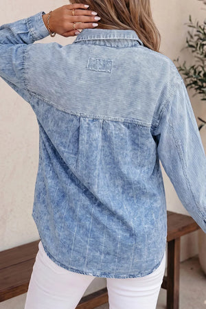 white button-down shirt featuring buttoned and striped