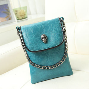 Turquoise crossbody bag with mini and flap closure