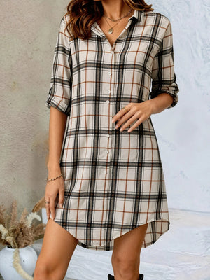 black shirt dress featuring buttoned and plaid