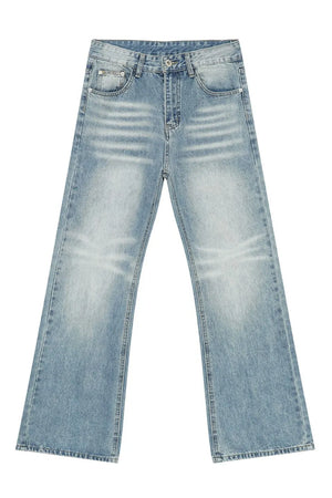 Wide leg washed denim trousers in medium blue with a relaxed fit.