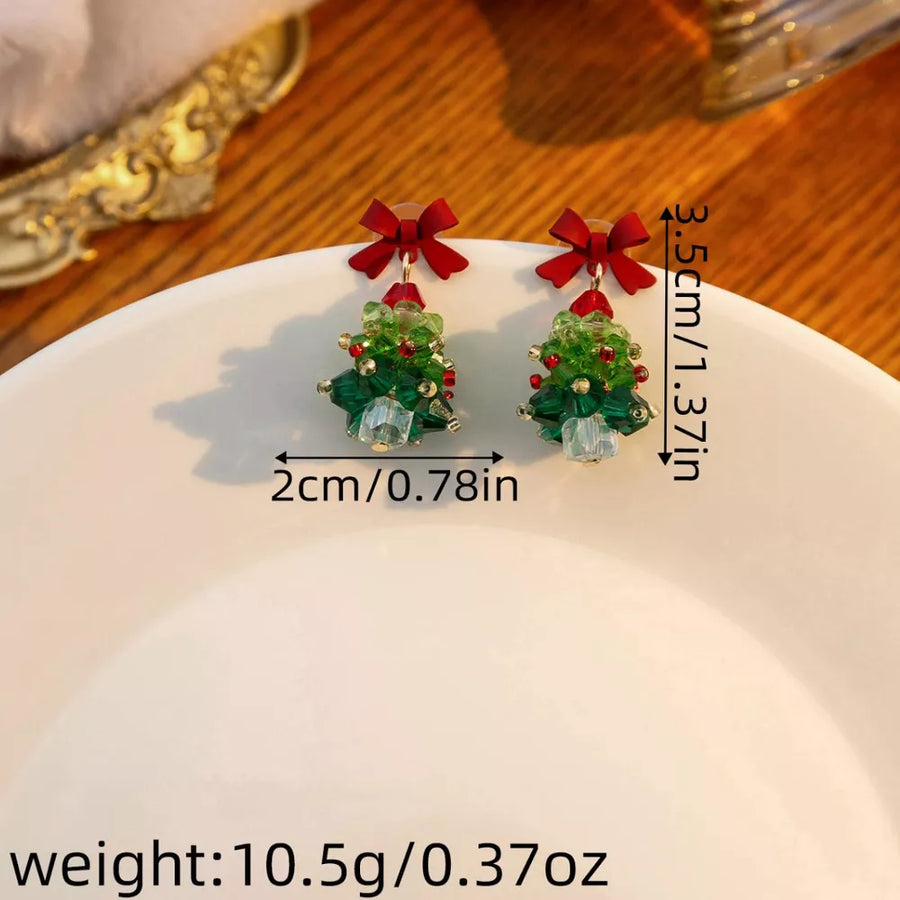 earrings in forest green with Christmas tree motif and dangle