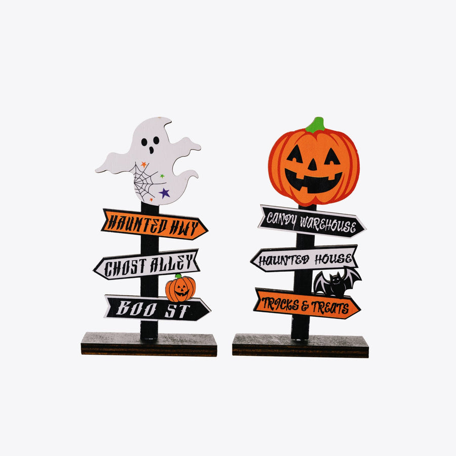 Halloween directional signs with ghost and pumpkin toppers, featuring spooky destinations.