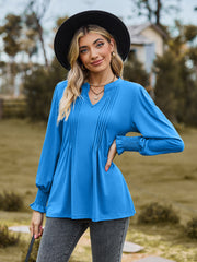 Sky blue blouse with pleated yoke and shirred cuffs