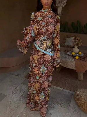 Brown celestial print maxi dress with long bell sleeves and a matching scarf.