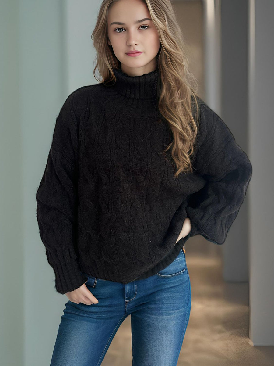 Black oversized cable knit turtleneck sweater with acrylic blend.