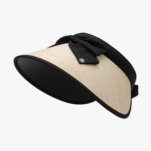 Bow-adorned visor with raffia brim and black trim.