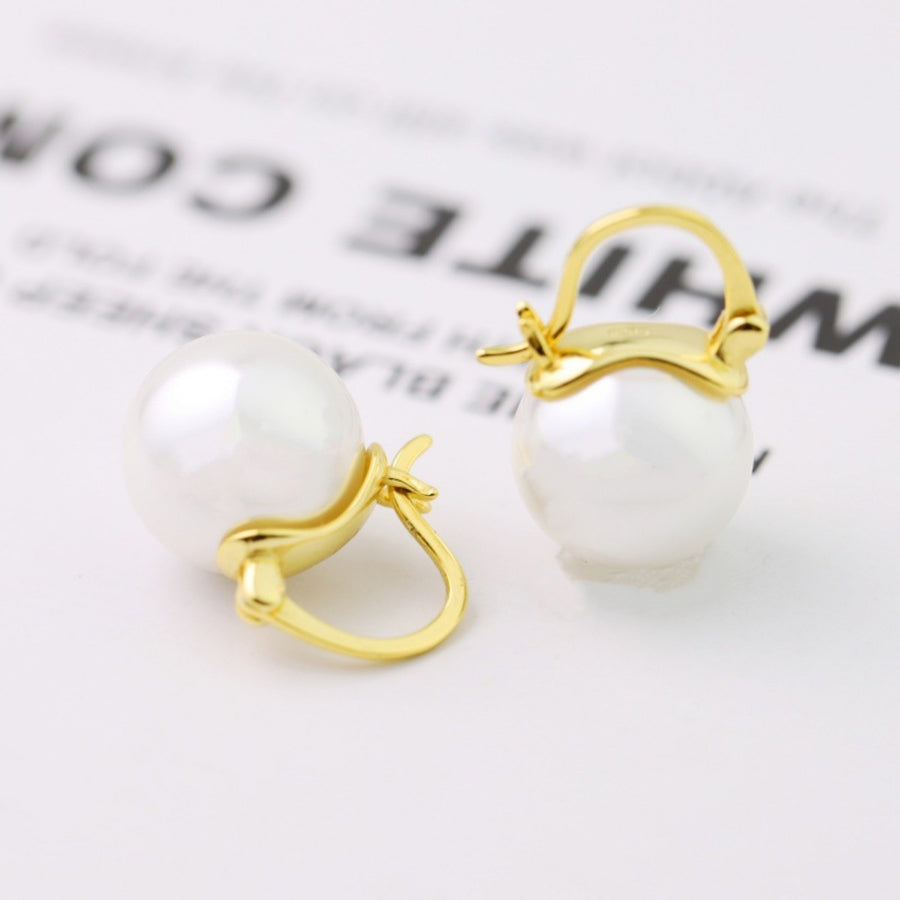 Gold plated pearl hoop earrings with a chic, classic design.