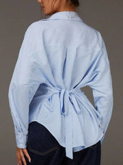 white button-down shirt featuring collared and striped