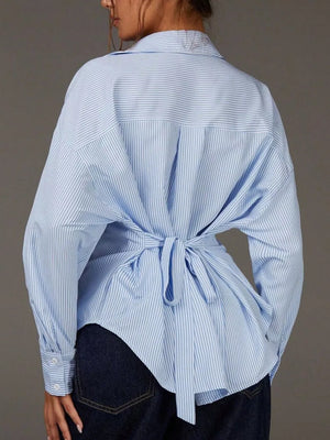 white button-down shirt featuring collared and striped