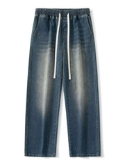 Vintage wash wide-leg jeans in light blue with elastic waistband and drawstring.