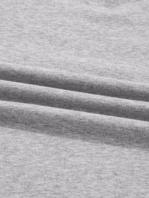 Gray ribbed knit long-sleeve top with subtle texture detail
