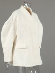 coat in cream with pocketed and hip-length