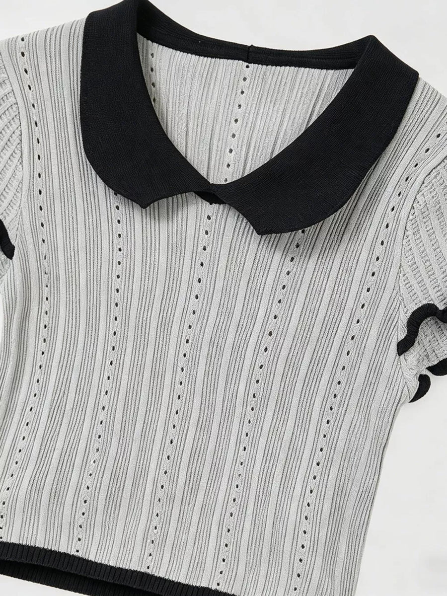 Gray knit maternity t-shirt with black Peter Pan collar and ruffled sleeves.
