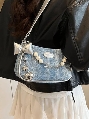 Light denim shoulder bag with pearl chain, silver bow and heart charms