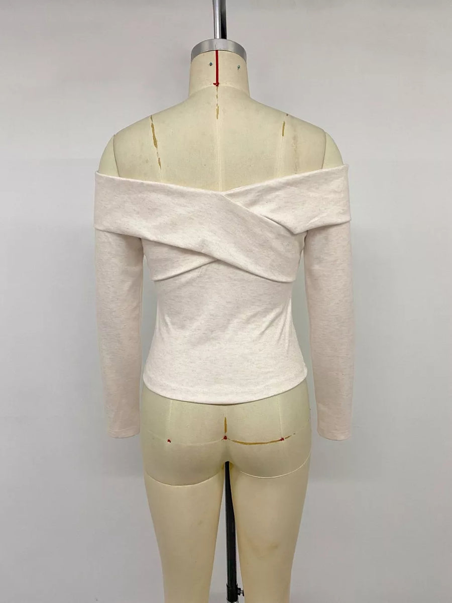 Off-the-shoulder long sleeve top in light heathered beige with a criss-cross neckline detail.