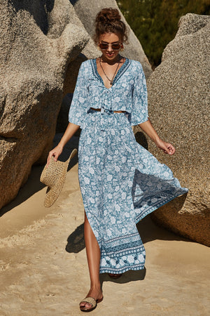 Light blue floral print crop top and maxi skirt set with tie front and high slit.