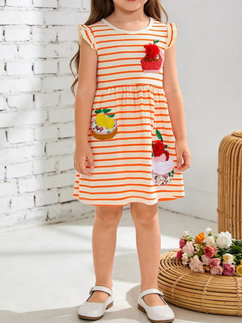 Toddler dress with orange stripes, cupcake appliques, and ruffled cap sleeves.