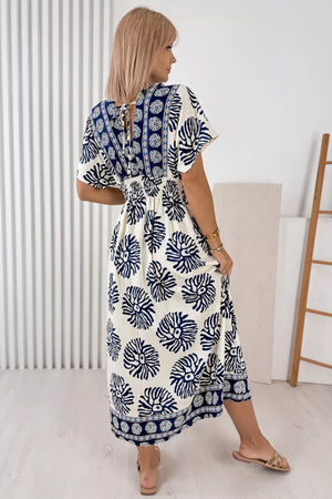 Blue floral print ankle length dress with V-neck and tie back detail