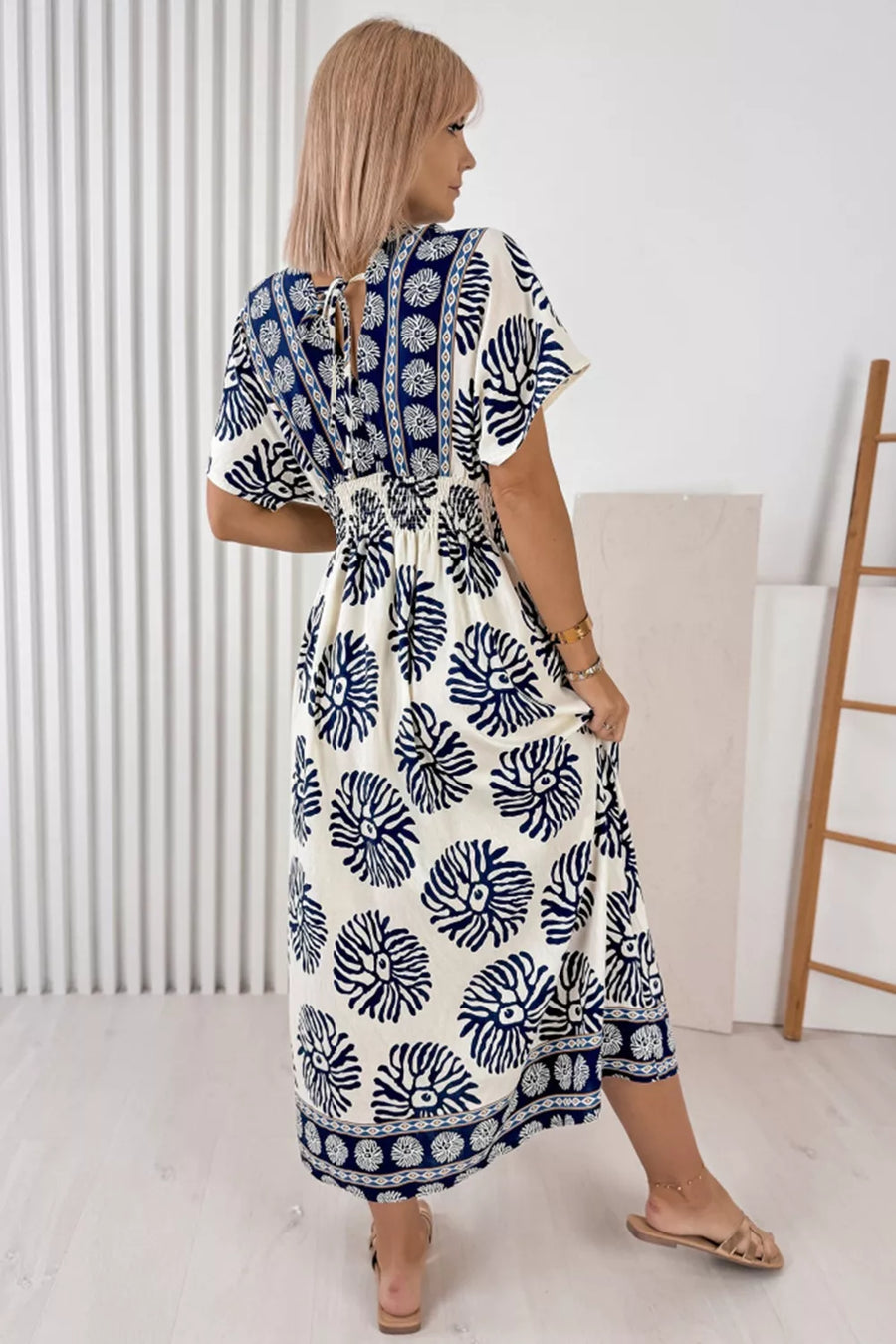 Blue floral print ankle length dress with V-neck and tie back detail